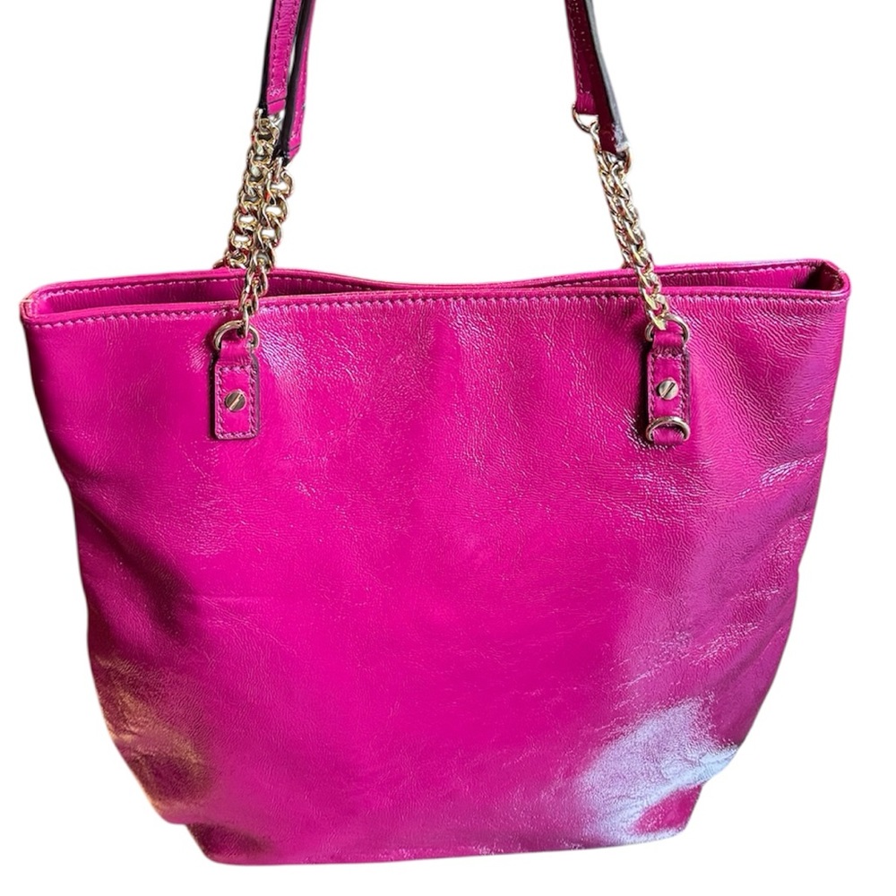Michael Kors patent leather handbag in a sleek, glossy finish.